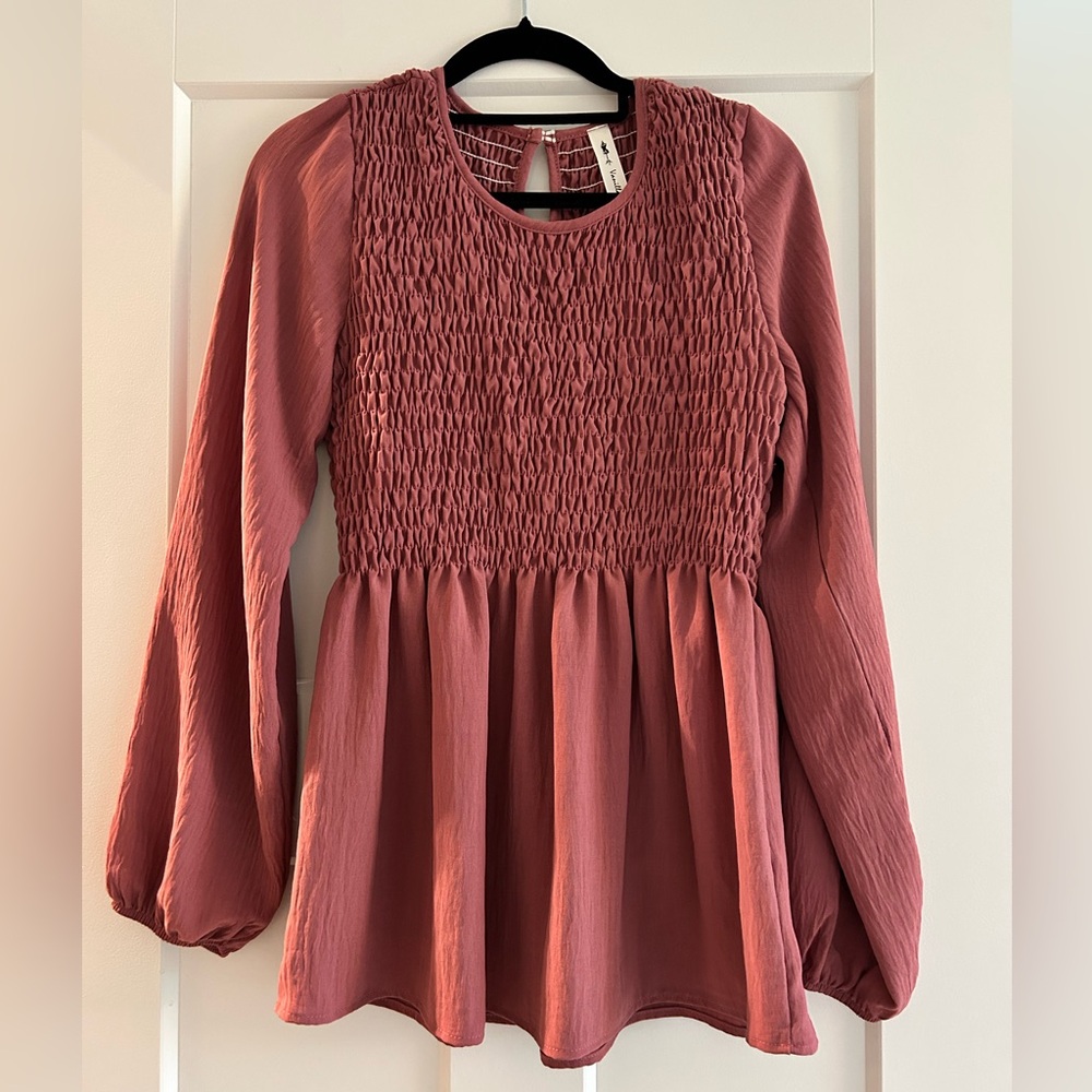 Mauve colored blouse